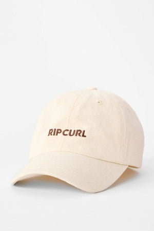 The Rip Curl Premium Surf Cap is a beige cotton twill surf hat featuring "RIP CURL" embroidered in brown on the front. Adjustable fit. Displayed against a plain white background.