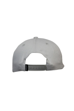 The Rip Curl Searchers SB Cap is a white cotton twill cap shown from the back, with an adjustable gray snapback closure and a small black tag on the left side against a plain white background.