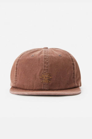 The Rip Curl Searchers Canvas Cap is a brown adjustable cap with a simple gold embroidered logo on the front, set against a plain white background, making it a versatile accessory.