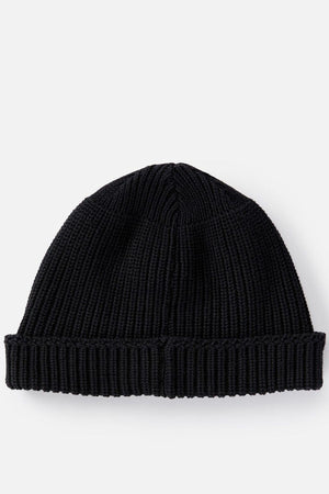 The Rip Curl Searchers Regular Beanie, a black knit with a folded brim, combines surf-inspired style and function against a plain white backdrop, offering the perfect blend of casual flair.