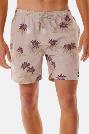 The Rip Curl Sun Razed Floral Volley shorts feature a light brown floral pattern in purple and beige. Made from quick-dry fabric, they include a drawstring waist and two small reflective circles on the front. A plain white backdrop highlights their style and performance.