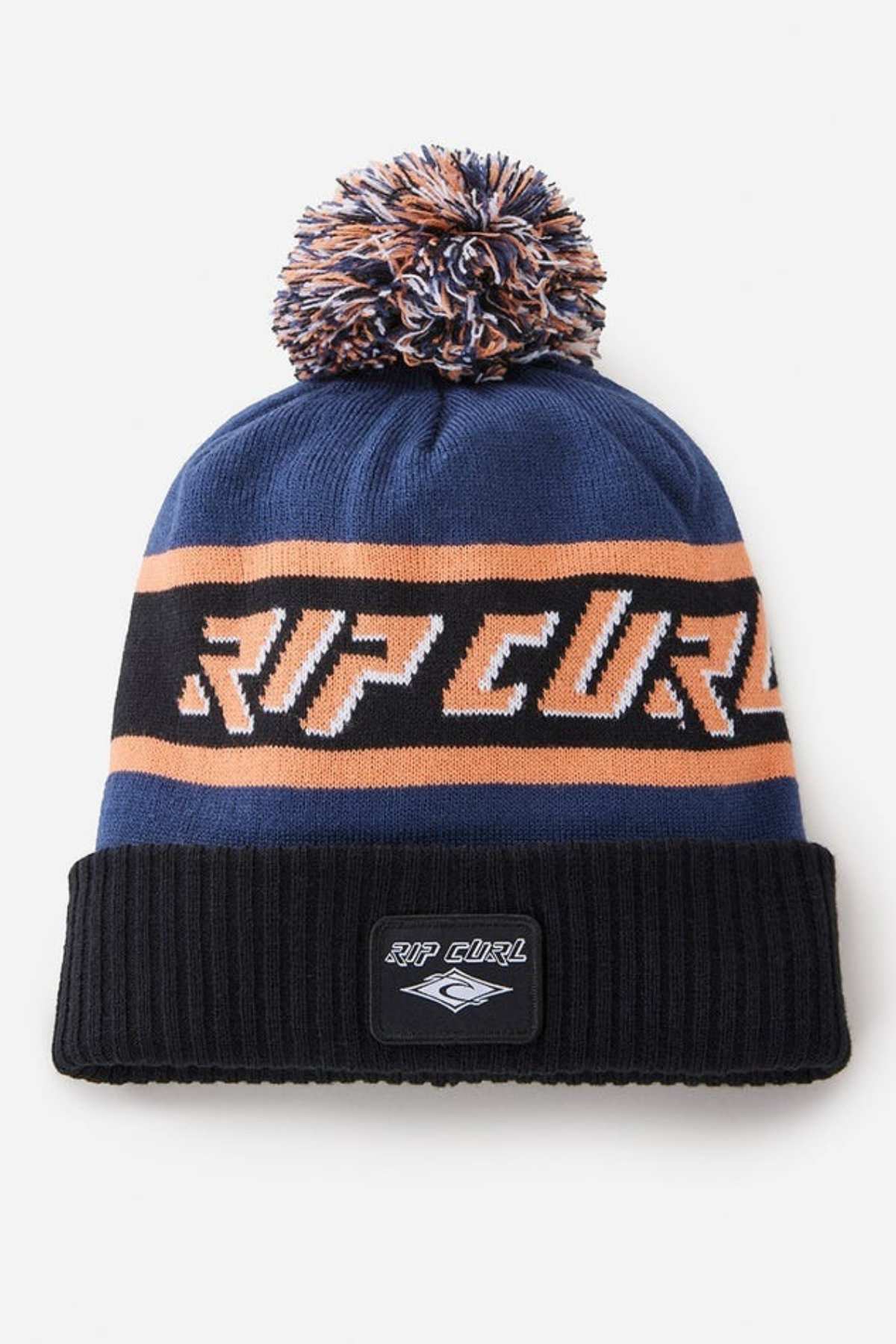 Stay warm in style with the Rip Curl Tow In Tall Beanie, featuring cozy acrylic yarn, bold "RIP CURL" lettering, blue, black, and orange stripes, a playful pom-pom, and a logo patch on the black brim.