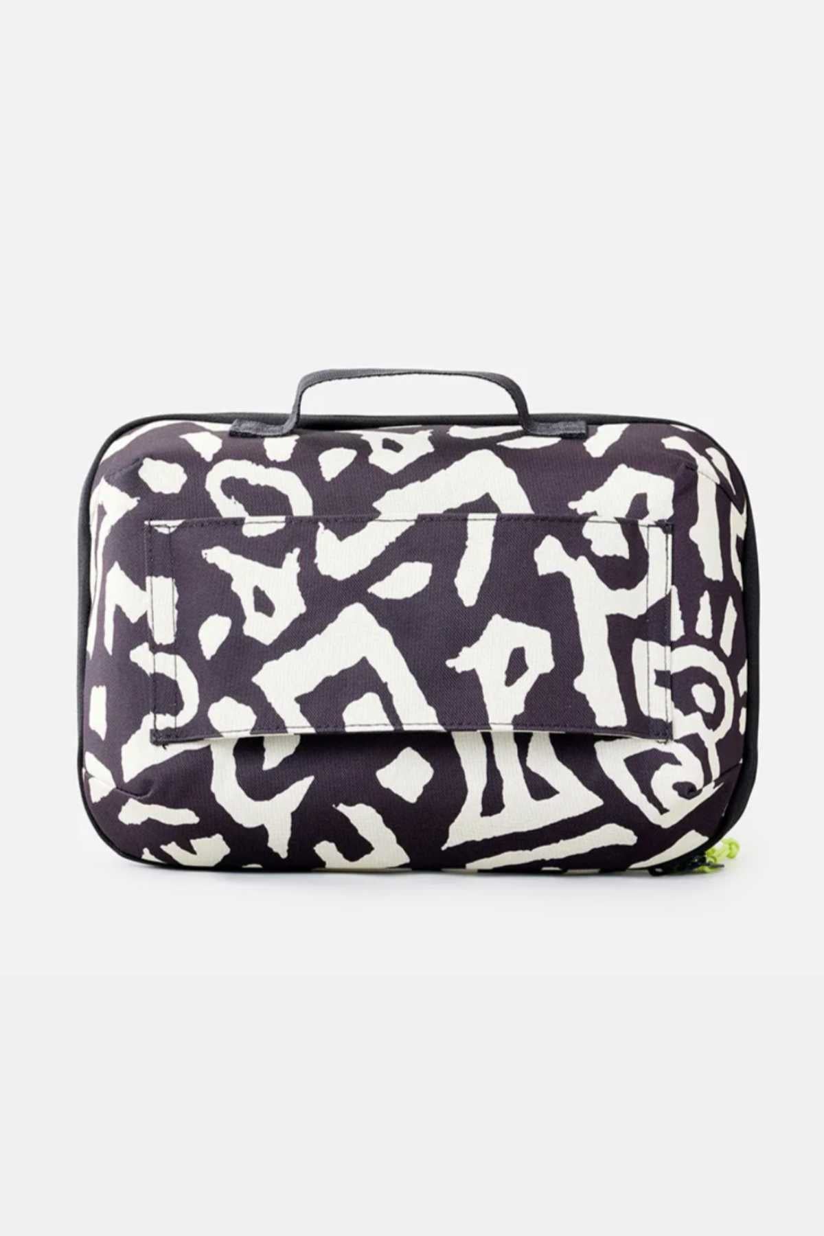 The Rip Curl Ultimate Beauty Case is a rectangular bag adorned with a black and white pattern, complete with a top handle and an external front pocket. It boasts abstract designs across the surface, delivering a modern and artistic look. Perfect for carrying your beauty essentials, this travel companion helps you stay stylish on the go.