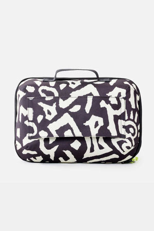 The Rip Curl Ultimate Beauty Case is a rectangular bag adorned with a black and white pattern, complete with a top handle and an external front pocket. It boasts abstract designs across the surface, delivering a modern and artistic look. Perfect for carrying your beauty essentials, this travel companion helps you stay stylish on the go.