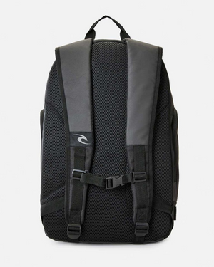 The Rip Curl Posse 33L Backpack, shown in black and gray, features padded shoulder straps, a top handle, adjustable chest strap, mesh ventilation panels, and an insulated drink pocket.