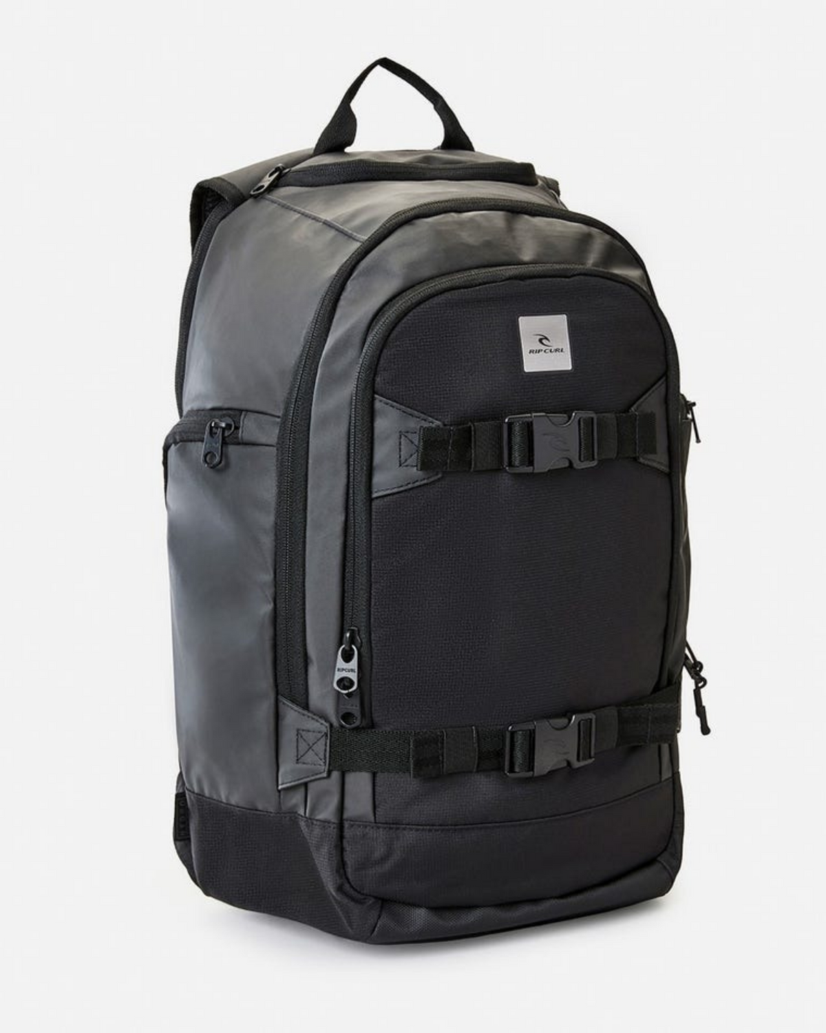 The Rip Curl Posse 33L Backpack in black is crafted from recycled polyester and features multiple zip compartments, an insulated drink pocket, adjustable front straps, padded shoulder straps, a top handle, and a front logo patch.