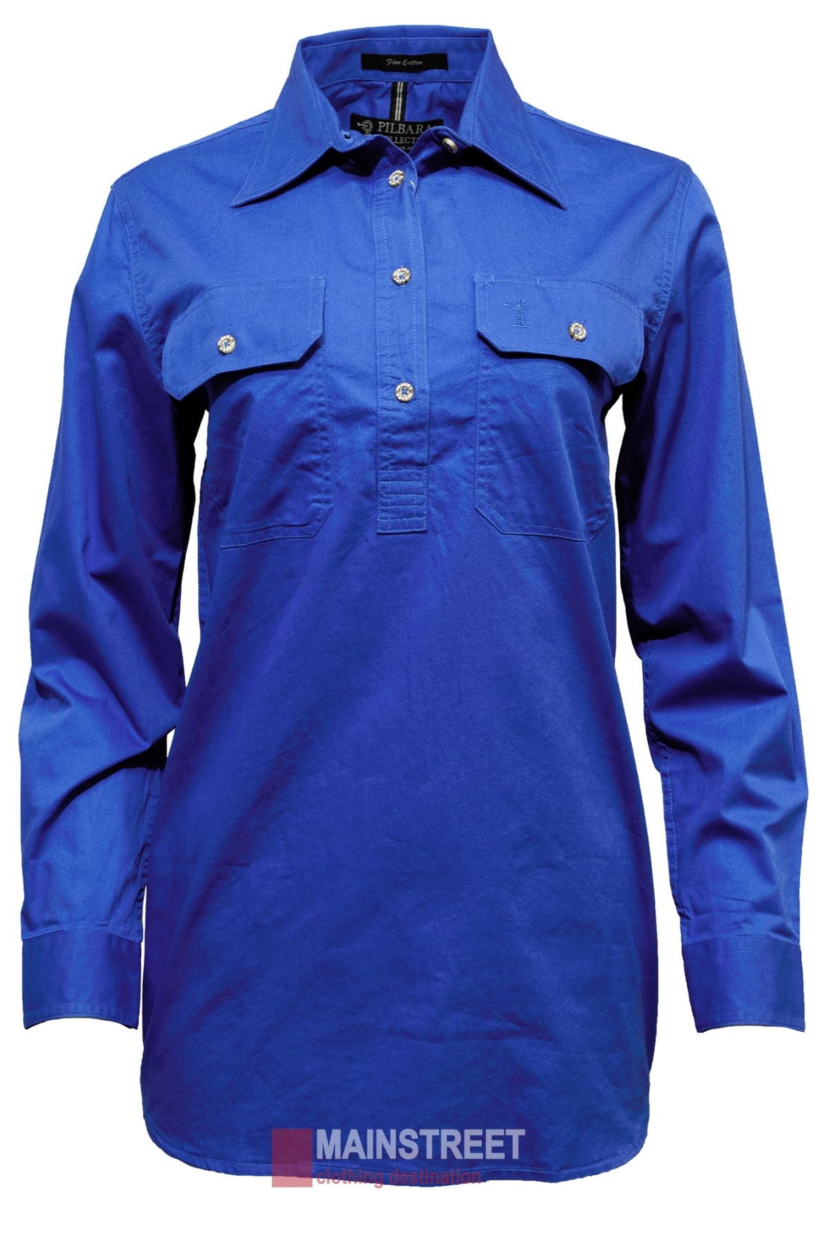 The Pilbara Ladies Long Sleeve Closed Front Shirt is a 100% cotton blue button-up featuring two buttoned front pockets, long sleeves, a UPF rating of 50+, and a visible collar tag.