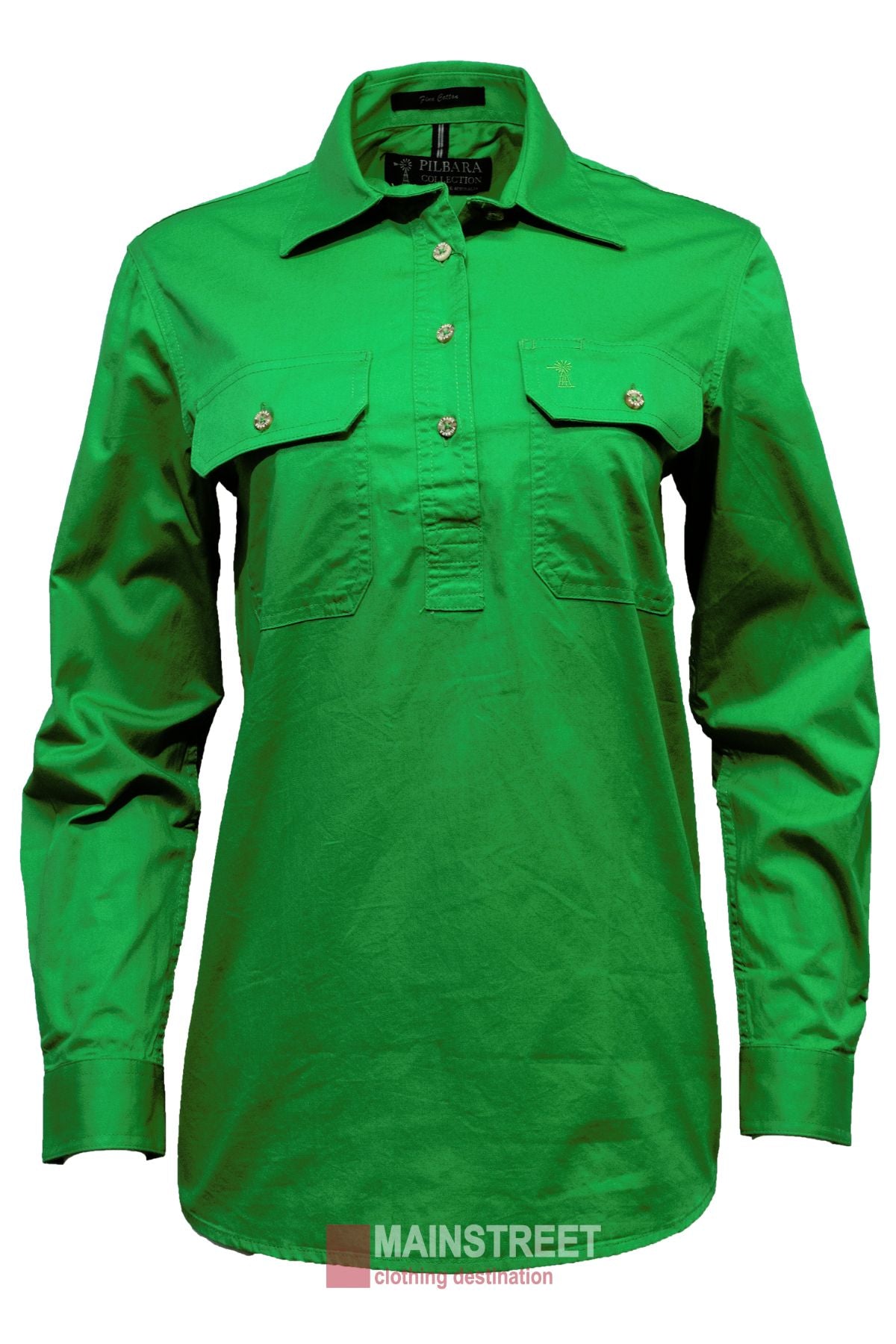 The Pilbara Ladies Long Sleeve Closed Front Shirt is a bright green, collared 100% cotton women's work shirt with two chest pockets and buttoned cuffs, shown against a white background with the "MAINSTREET" logo at the bottom.