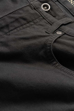 Close-up of black denim fabric from the Rodd & Gunn Motion 2 Straight Jean, featuring the front pocket, waistband with button, and YKK zip fly. Stitching details enhance the durable comfort stretch fabric, highlighting its sturdiness.