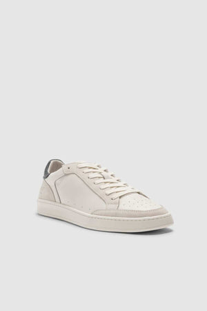 The Rodd & Gunn Sussex Street Sneaker, a low-profile white leather sneaker with perforated toe box, white laces, and a contrasting dark heel tab, is displayed against a plain light gray background.