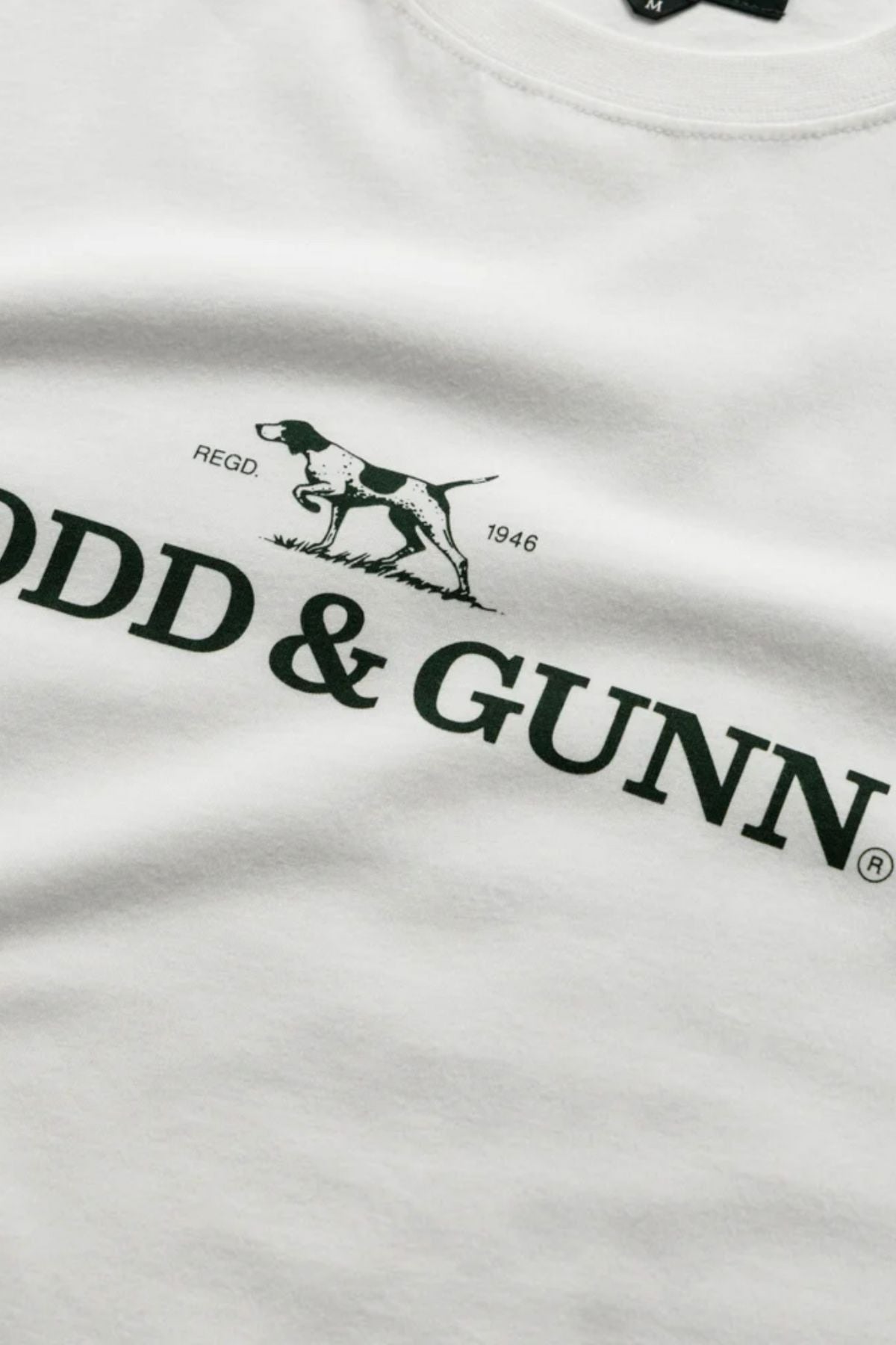 The Rodd & Gunn The Logo Tee 2.0 is a white 100% cotton menβs sports t-shirt with a black logo print, hunting dog illustration above the text, and "REGD. 1946" on either sideβa classic style statement.