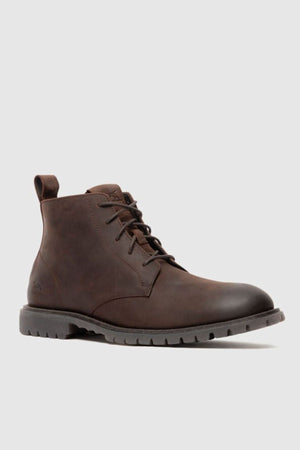 The Rodd & Gunn Clearview Chukka Boot features brown USA crazyhorse leather, a black translucent rubber outsole, and a back pull loop, shown on a plain light gray background.