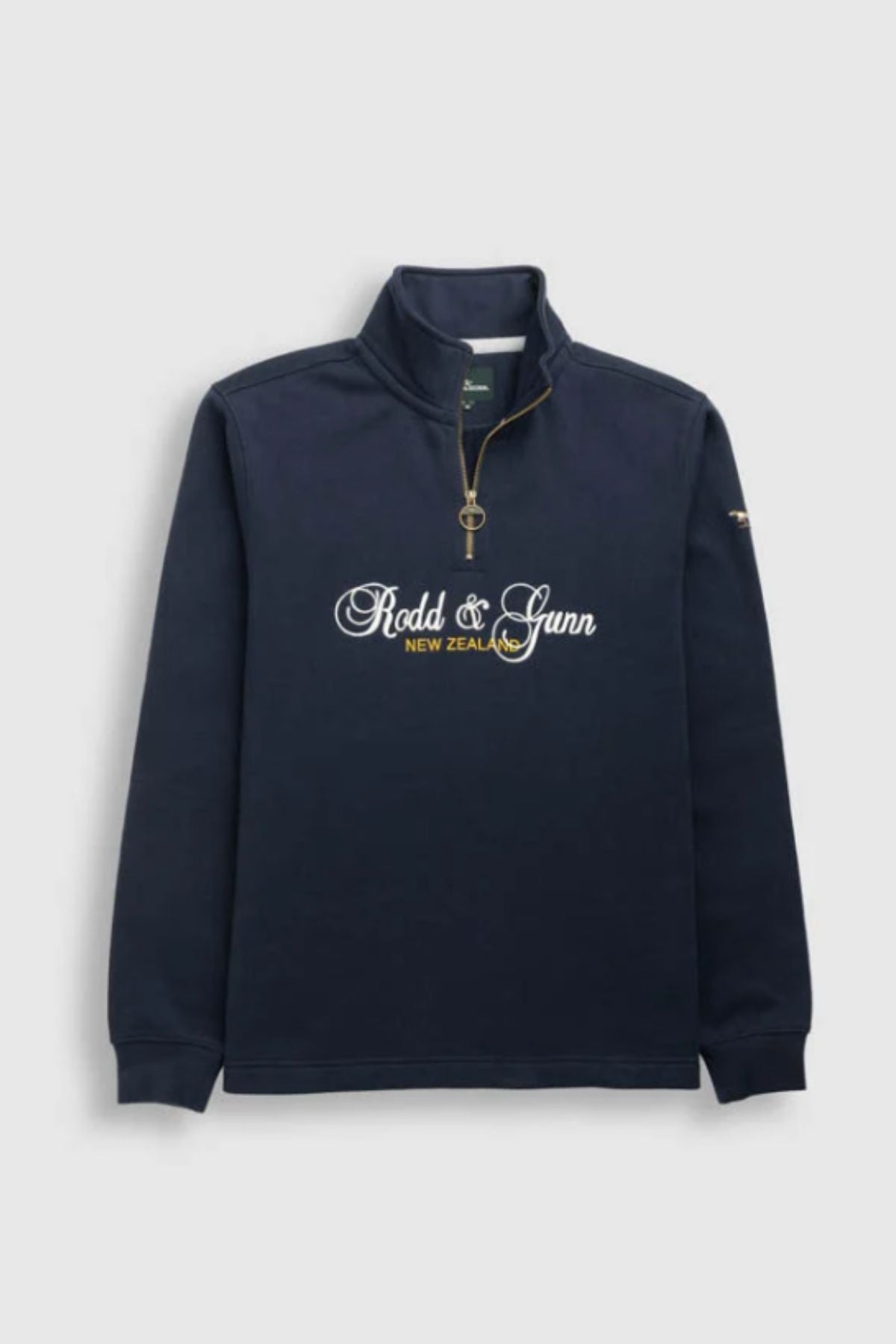 The Rodd & Gunn Jubilee Sweat is a navy long-sleeve quarter zip pullover with a gold zipper, ribbed cuffs, and "Rodd & Gunn New Zealand" in white script on the front, crafted with sustainable methods.