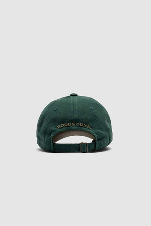 The Rodd & Gunn Signature Cap features a heavy-duty cotton twill on the back, an elegant gold "RODD & GUNN" embroidery, an adjustable strap, and a plain light gray background.