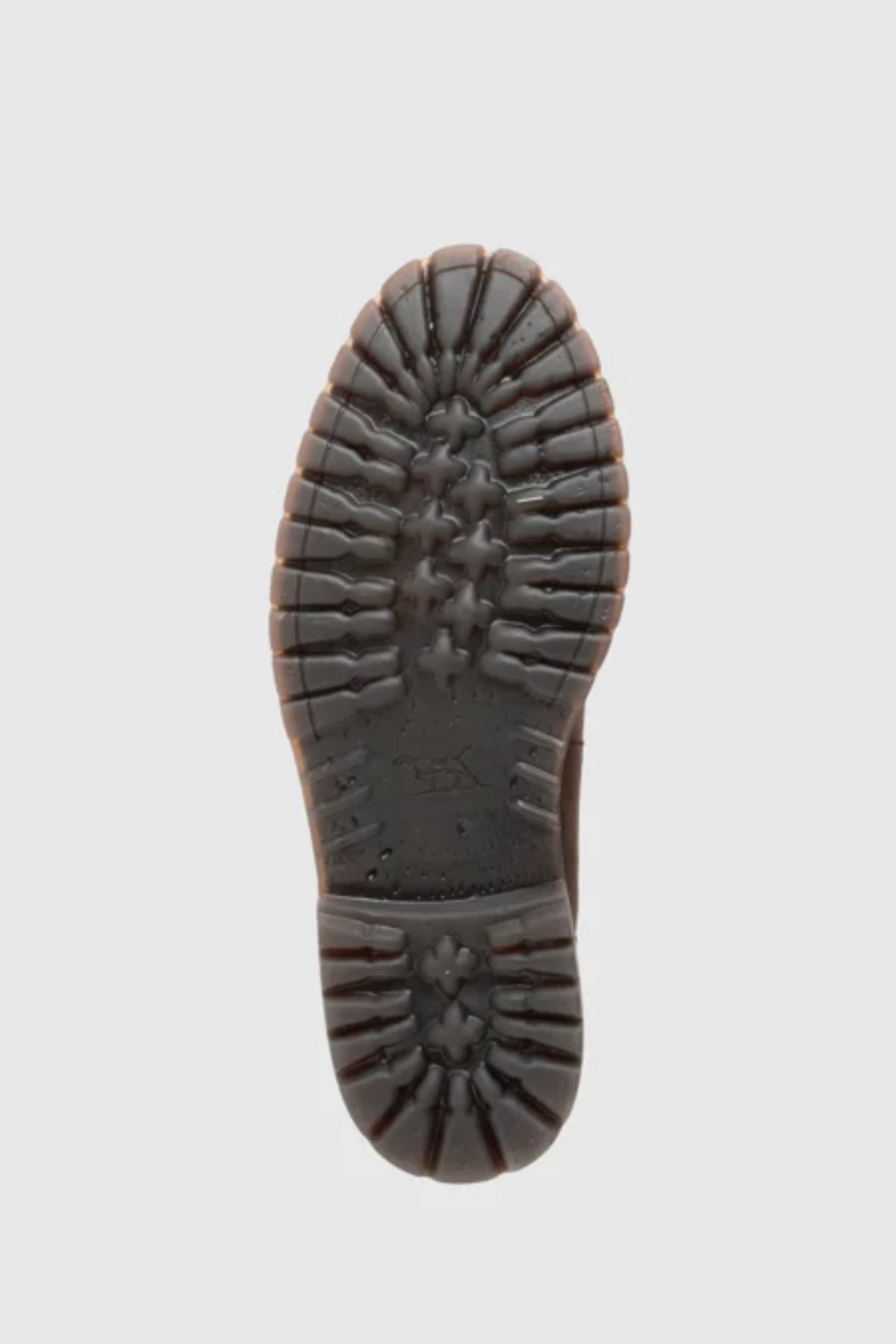 The image displays the bottom view of the Rodd & Gunn Clearmont Chelsea Boot, featuring a dark sole with rugged, textured tread for grip and durability. The plain light gray background complements its stylish design and comfortable fit.