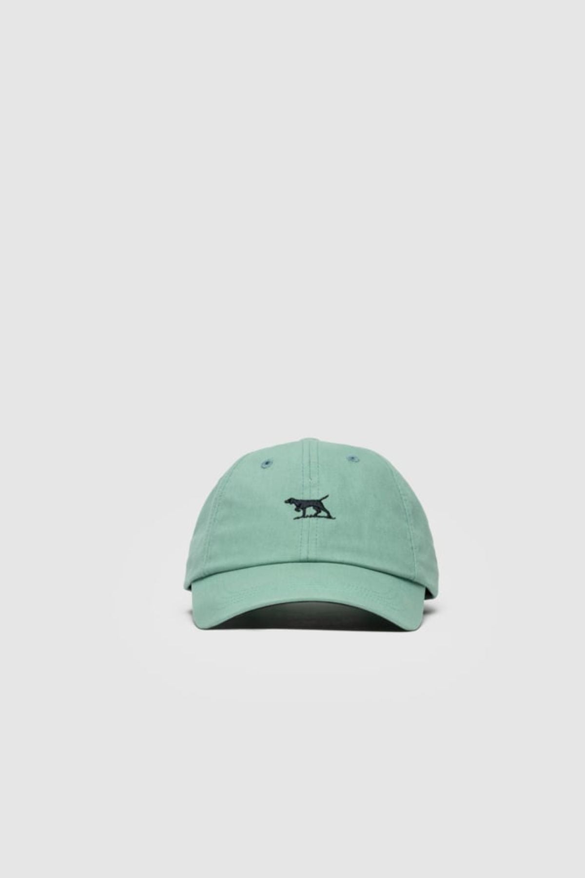 The Rodd & Gunn Gunn Cap is a light green cotton twill cap featuring a small black embroidered animal on the front, shown against a plain white background.