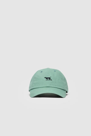 The Rodd & Gunn Gunn Cap is a light green cotton twill cap featuring a small black embroidered animal on the front, shown against a plain white background.