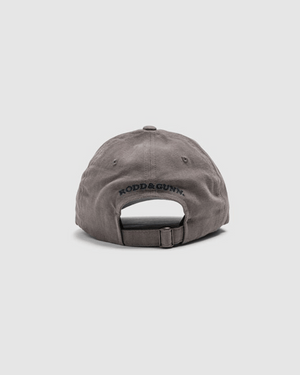 The Rodd & Gunn Signature Cap is a gray cotton twill baseball cap, seen from the back, featuring an adjustable strap and "RODD & GUNN" embroidered in black above the opening.
