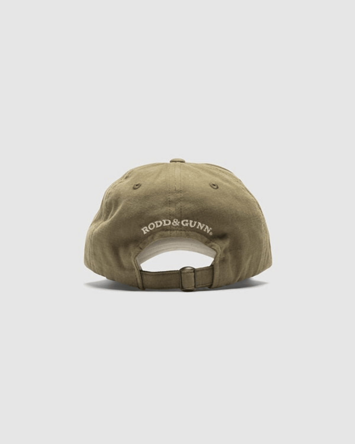 A rear view of the Rodd & Gunn Signature Cap shows it in brown Cotton Twill, featuring "RODD & GUNN" in white and equipped with an adjustable strap for a perfect fit.