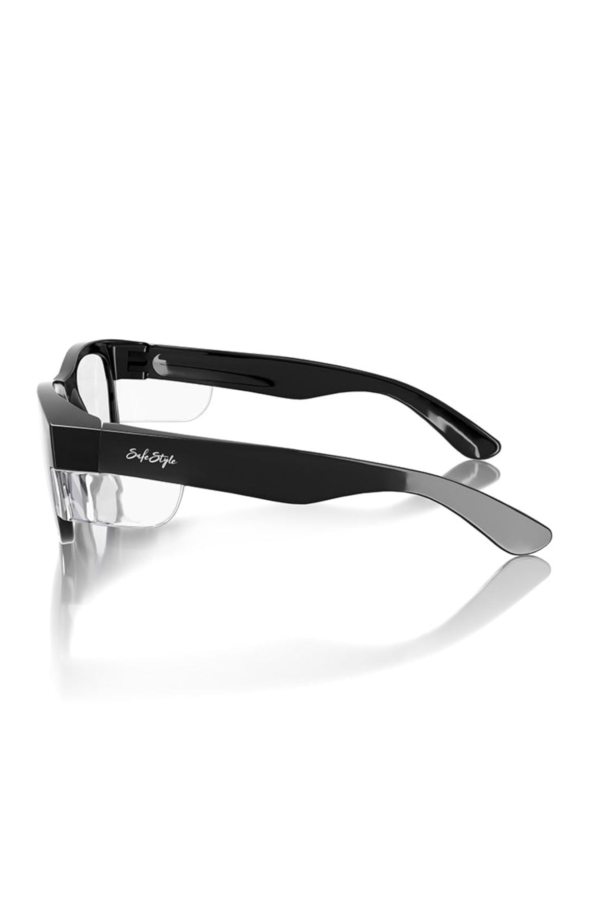 Side view of a pair of SafeStyle Classics Black Frame Clear Lens glasses. The frame boasts a minimalistic design, and the brand name "Styl Style" is prominently displayed on the arm. They are positioned against a white background with a slight reflection beneath.