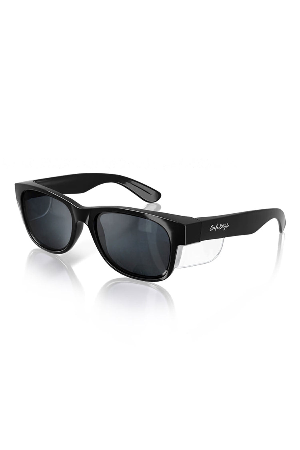A pair of SafeStyle Classics Black Frame Tinted Lens sunglasses with dark tinted lenses and side shields. The frame features a glossy finish, with the signature "Bobster" logo visible on the arm. Offering UV protection for your eyes, these glasses are displayed on a reflective white surface.