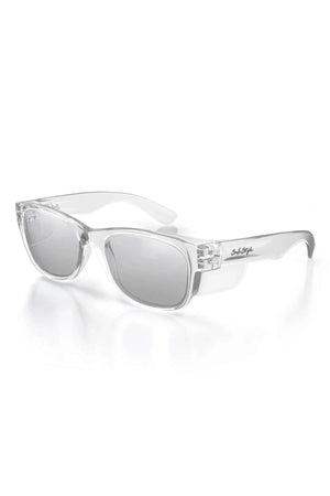 The SafeStyle Classics Clear Frame Hybrids boast photochromic lenses with UV protection and shatterproof polycarbonate for durability. On a white background, the arms feature a subtle inscription near the hinge, enhancing their modern, minimalist design.