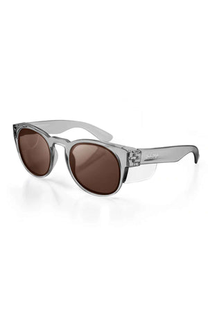 The SafeStyle Cruisers feature a graphite polycarbonate frame and brown polarised lenses for superior UV protection, shown on a white background.