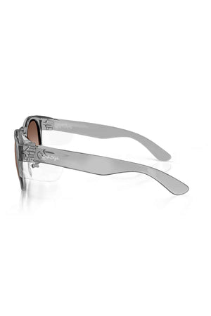 The SafeStyle Cruisers feature transparent gray polycarbonate (Graphite) frames and brown polarised lenses with UV protection, shown from a side angle on a white background.
