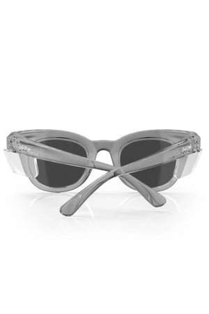 The SafeStyle Harps sunglasses, featuring a graphite frame and polarised lenses, rest on a white surface. With shatterproof frames and crossed arms, they offer a sleek design that combines modern style with essential UV protection.