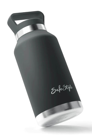 The Safestyle Big Juicy 1L water bottle is black with double-wall vacuum insulation, a silver base and lid, and a carrying handle. It features "Safe Style" in white on the side and is leak-proof by design. The insulated stainless steel bottle is pictured against a plain white background.