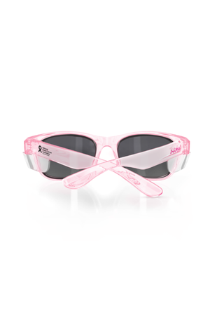 The SafeStyle Classics Pink Frame Polarised Lens sunglasses have dark lenses with UV400 protection and feature the Susan G. Komen breast cancer ribbon on the left temple. The arms are crossed, displayed against a white background.