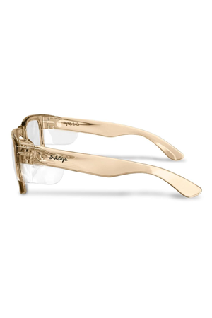 Side view of SafeStyle Fusions glasses with translucent champagne frames and clear lenses. Stylish protective eyewear featuring the “Spitfire” logo in black on wide arms that curve slightly at the ends.