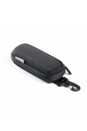 The Safestyle Hardcase is a compact black zippered sunglasses case made of durable nylon, featuring a fabric tag and an easy-release clip for convenient carrying. Shown against a white background.