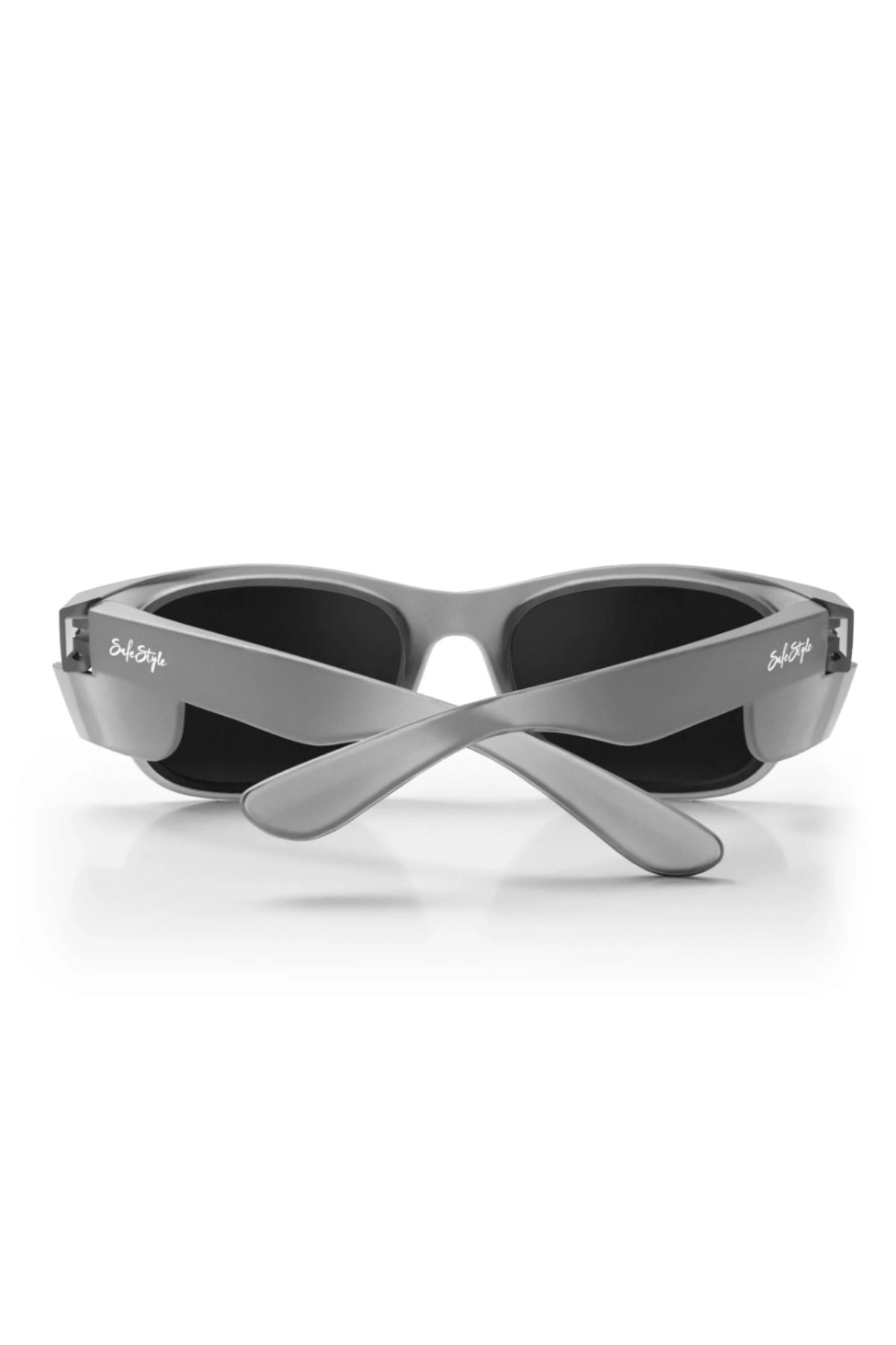 The Safestyle Classics Matte Graphite Frame Polarised Lens sunglasses are shown from the back with crossed arms and subtle white logos, featuring black polarised lenses and UV400 protection—ideal stylish eyewear against a white background.