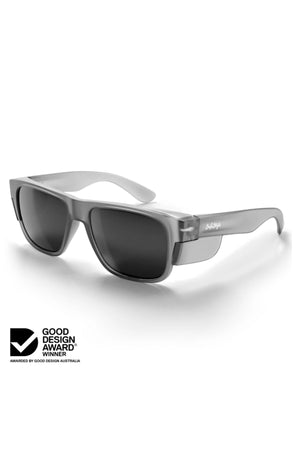 A pair of stylish Safestyle Fusions Matte Graphite Frame sunglasses with polarised lenses and UV400 protection is displayed on a white background. The Good Design Award Winner logo appears in the lower left corner.