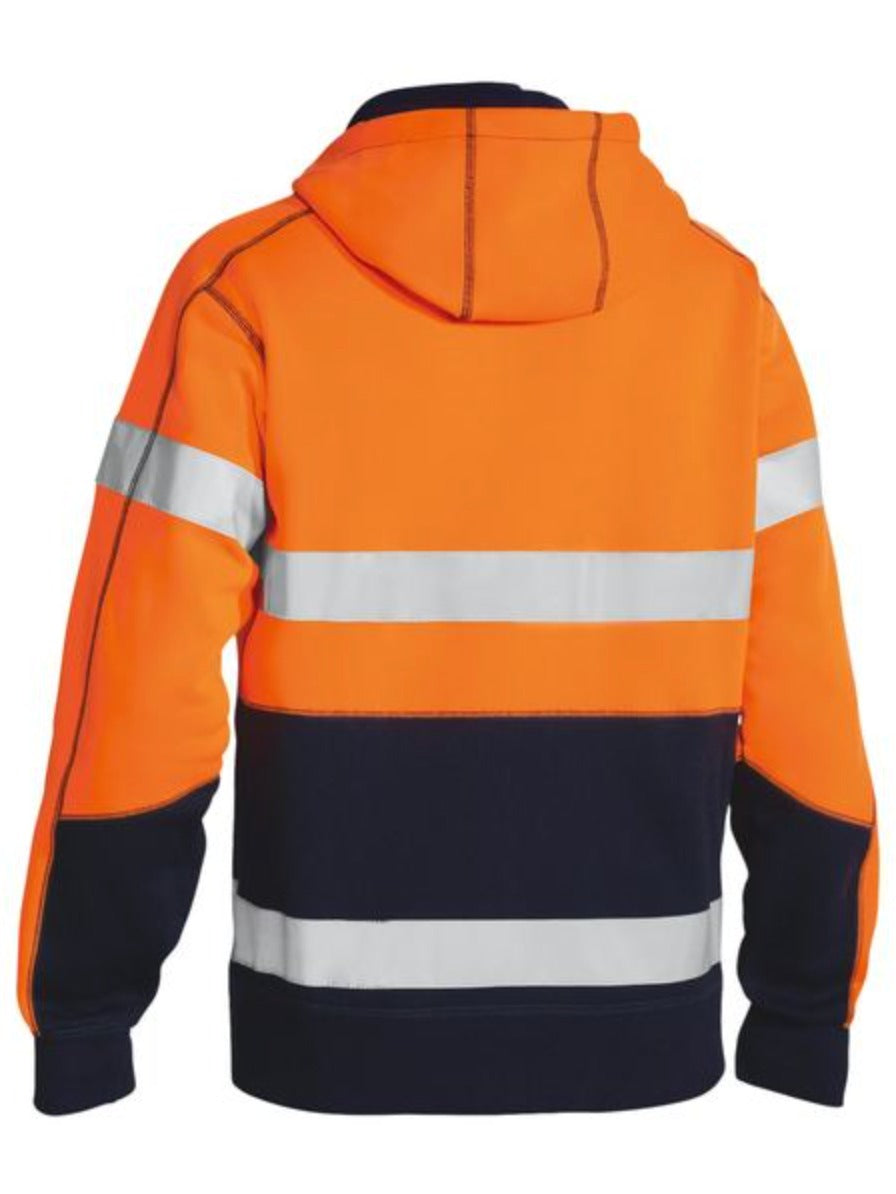 The Bisley Taped Hi Vis Fleece Hoodie is a comfortable jacket with a hood, bright orange upper section, dark navy lower part, and two reflective taped hoops on the back and arms for enhanced visibility.
