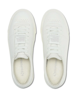 Viewed from above, the Superga 4834 Club S Up sneakers showcase visible laces, branded insoles with "Superga," and a tongue label reading "People's shoes of Italy." Crafted from grape-based faux leather, they feature a simple and clean design.
