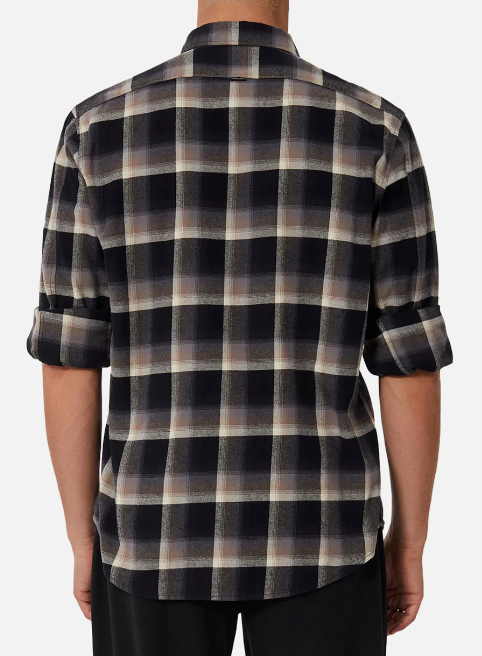 Someone is wearing the Industrie The Clifton Shirt, a long-sleeved, regular fit plaid with black, white, and brown colors made of 100% cotton. The sleeves are rolled up, the shirt is untucked, and only the back is visible.