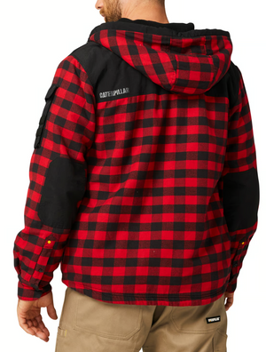 A person is seen from behind wearing a red and black CAT Sequoia Shirt Jacket with a cozy fleece lining and hood, black shoulder and elbow patches, featuring a "Caterpillar" logo on the back. They're also dressed in tan pants.