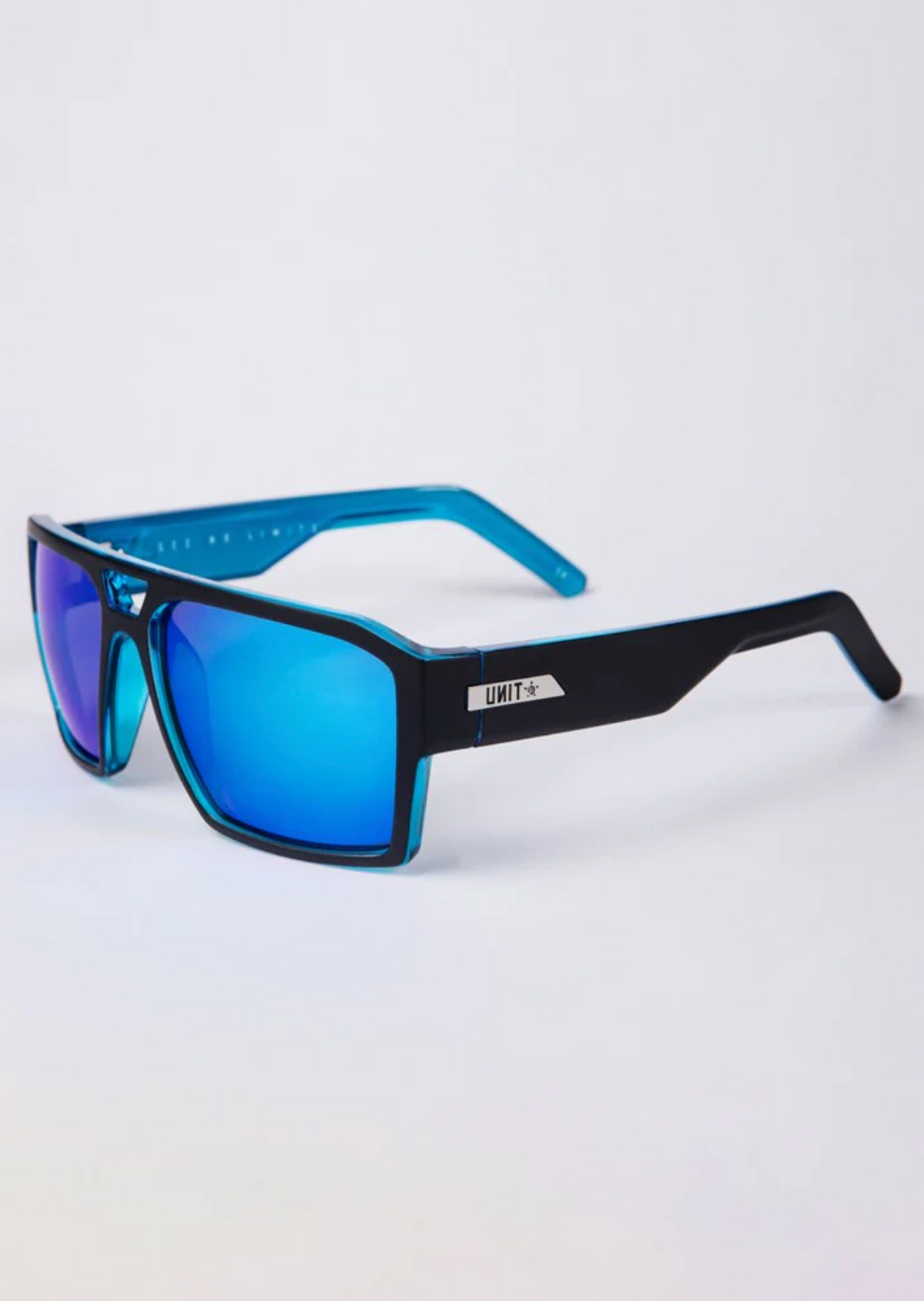 UNIT Vault Polarised Eyewear showcases sleek sunglasses with polarised rectangular blue mirrored lenses, UV protection, and a sturdy black and blue frame. The brand's logo is visible on the temple, set against a plain white background.