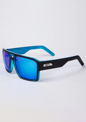 UNIT Vault Polarised Eyewear showcases sleek sunglasses with polarised rectangular blue mirrored lenses, UV protection, and a sturdy black and blue frame. The brand's logo is visible on the temple, set against a plain white background.