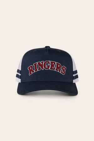 The Ringers Western Caleb Trucker Cap features navy and white colors, "RINGERS" embroidered in red and white on the front, two navy stripes on each side of the white mesh panels, and is made from durable cotton twill for comfort and style.