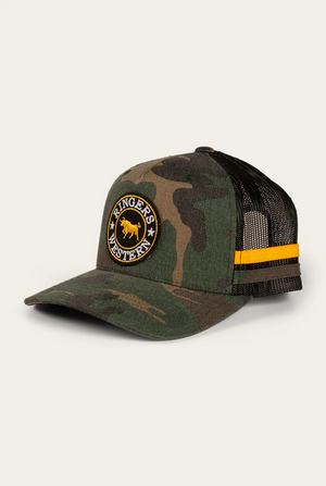 The Ringers Western McCoy Kids Trucker Cap has a camouflage print, black mesh back, adjustable strap, yellow stripe detail, and features a circular patch with "Ringers Western" text and a bull silhouette on the front.
