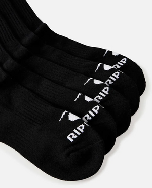 A set of five black crew socks from the Rip Curl Brand Crew Sock 5 Pack is laid out in a slightly fanned arrangement. Each sock, branded with Rip Curl, features white text and a small design on the toe area. They also provide arch support for added comfort. The background is a plain white surface.