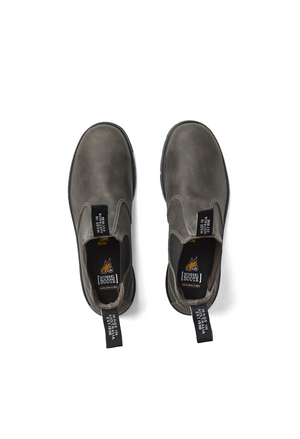 The Mongrel K9 Elastic Sided Boot K91085 is a premium leather brown slip-on with black elastic panels. From above, the insoles display an orange icon saying "BOOTS." Pull tabs are at the front and back, complemented by the Orthotec Lite footbed for comfort.