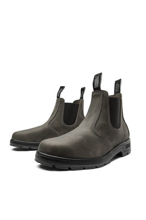 The Mongrel K9 Elastic Sided Boot K91085 is a pair of dark brown Chelsea boots made from premium leather, featuring elastic side panels and back pull tabs. They have a rugged matte finish, black rubber soles, and an Orthotec Lite footbed for enhanced comfort.