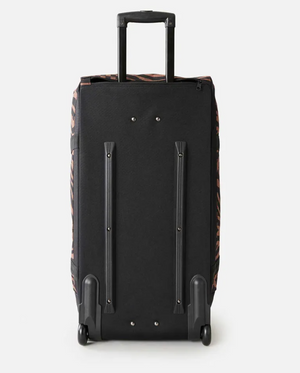 The Rip Curl Jupiter 80L Travel Bag is a black, water-resistant rolling suitcase with two wheels, an extended telescopic handle, and subtle brown and black animal print accents on the sides. It stands upright showing its back and wheel supports.
