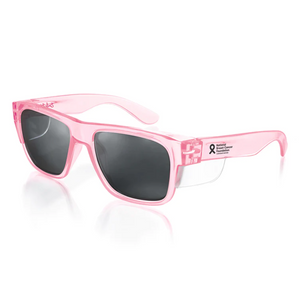 The SafeStyle Fusions Pink Frame Polarised Lens sunglasses feature pink polycarbonate frames, dark polarised lenses, and a breast cancer ribbon with "National Breast Cancer Foundation, Inc." on the left arm for style and support.