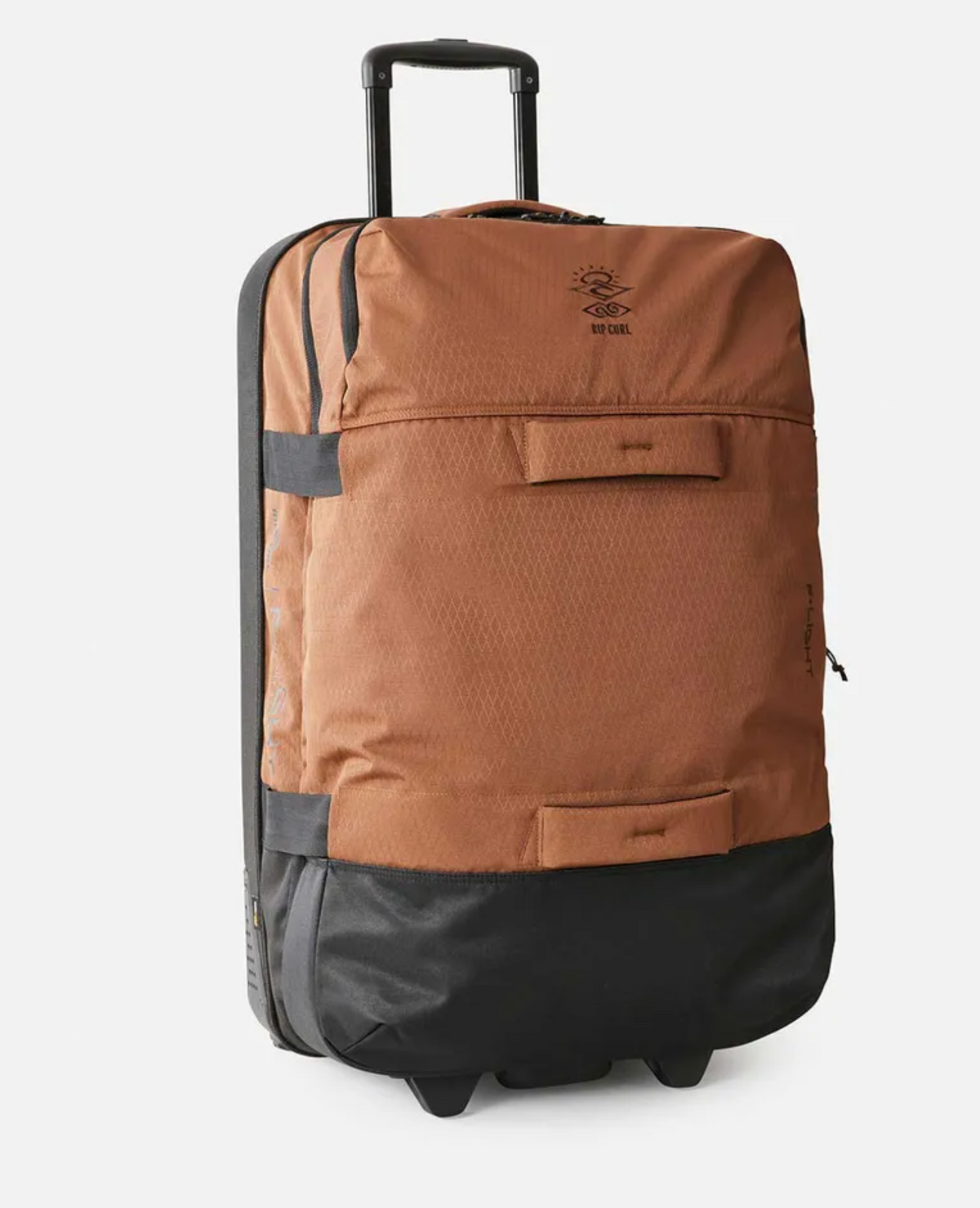 The Rip Curl F-Light Global 110L Searchers Travel Bag is a brown and black rolling suitcase with a telescopic handle, inline skate wheels, two outer pockets, recycled CORDURA polyester fabric, and a small logo near the top against a white background.