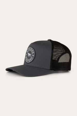 The Ringers Western Signature Bull Trucker Cap is a dark gray and black cotton twill cap with a mesh back, featuring a round front patch displaying a horse and the phrase "Wrangler Forever.